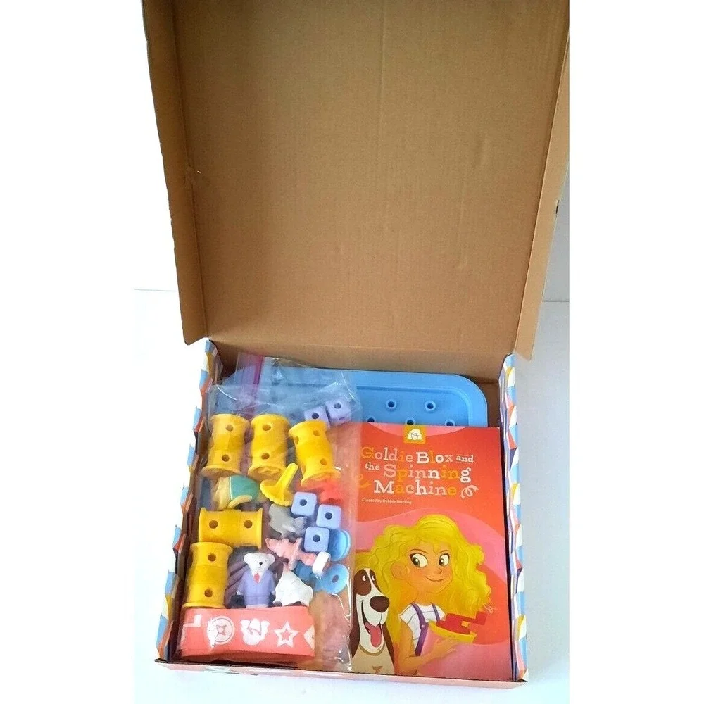 GoldieBlox and the Spinning Machine Engineering Toy Set with Book and 33 Pieces
